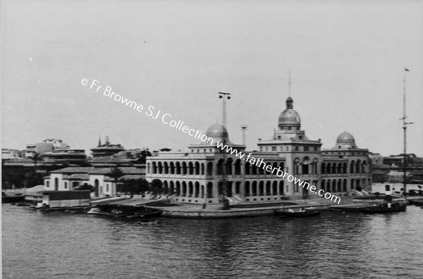 BUILDINGS VIEWED FROM SHIP ON SUEZ CANAL